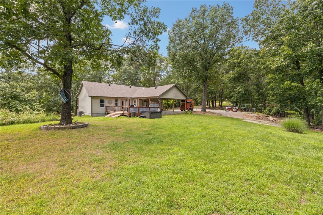 Welcome to 16490 Weaver Lane, a beautifully crafted custom home nestled in the scenic Rocky Ridge Estates just minutes from Beaver Lake. Built in 2018, this 1,700 square foot residence sits on 11 private, wooded acres—perfect for those seeking peaceful living with room to roam.
This all-electric home features timeless details throughout, including rich wood flooring, real marble countertops in the bathrooms, and handcrafted custom wood cabinetry that showcases the quality of construction. The thoughtfully designed floor plan offers comfort and function, making it ideal as a full-time residence or private retreat.
Tucked away in nature, this property also includes a charming small cabin—perfect for additional storage or a wood shop. With no immediate neighbors in sight, you’ll enjoy serene mornings, quiet evenings, and star-filled skies.
Don’t miss this rare opportunity to own a slice of Northwest Arkansas paradise—secluded yet close to the outdoor adventure and beauty of Beaver Lake. Two Parcels convey.