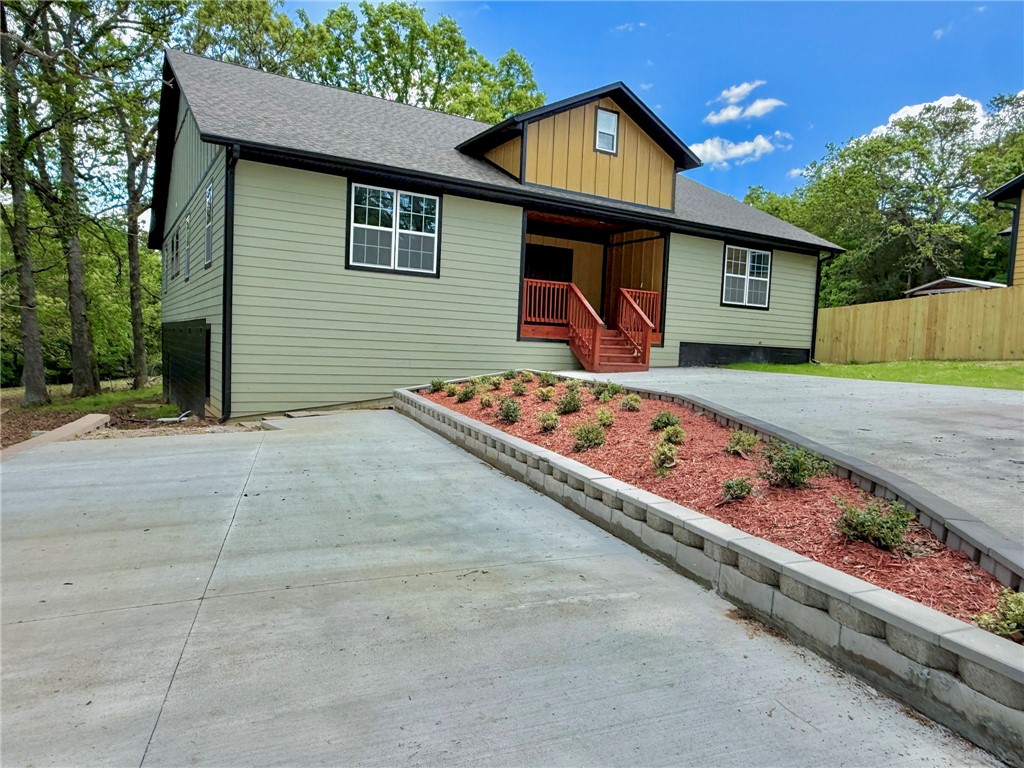 Rebuilt in 2024 from the foundation up, this stunning 4-bed, 3-bath home with an office/craft room feels brand new and sits on 2.72 mostly level acres in a highly desirable location. Enjoy the peace of being just outside city limits while still close to schools, parks, main roads, and only minutes from the award-winning Sassafras Springs Vineyard. The open floor plan showcases a beautiful kitchen with granite countertops, modern cabinetry, and plenty of space for entertaining. Foam insulation throughout makes the home exceptionally energy efficient, keeping utility costs low and comfort high. The split floor plan offers privacy, while high-end finishes and thoughtful upgrades create a stylish, move-in ready retreat. With new plumbing, electrical, HVAC, roof, and more, this property combines the charm of an established setting with the confidence of new construction. Plenty of space for outdoor living, gardening, or a future shop! Don’t miss your chance to own this beautiful home with acreage and convenience!