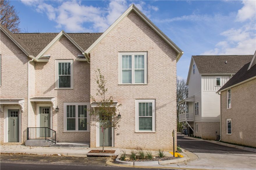 Fully furnished and move-in ready, this modern 2-bedroom, 2-bath townhome is a standout opportunity for investors, short-term rental hosts...or Razorback fans! Featuring an open-concept design, sleek kitchen with stainless steel appliances, luxury vinyl plank flooring, and spa-inspired bathrooms, this townhome offers comfort and style in every corner. All designer furnishings, the Simply Safe security system, mounted TVs, and full-size stackable washer/dryer will convey, making this an ideal Airbnb-ready property if you so choose. Guests and owners alike will enjoy outdoor living with a private patio and the rare bonus of 2 dedicated parking spaces directly behind the unit. This prime location is within walking distance to the University of Arkansas, Dickson Street, dining, shopping, and the Razorback Greenway. Whether you’re looking for a primary home, long-term rental, or vacation property, this townhome checks all the boxes.