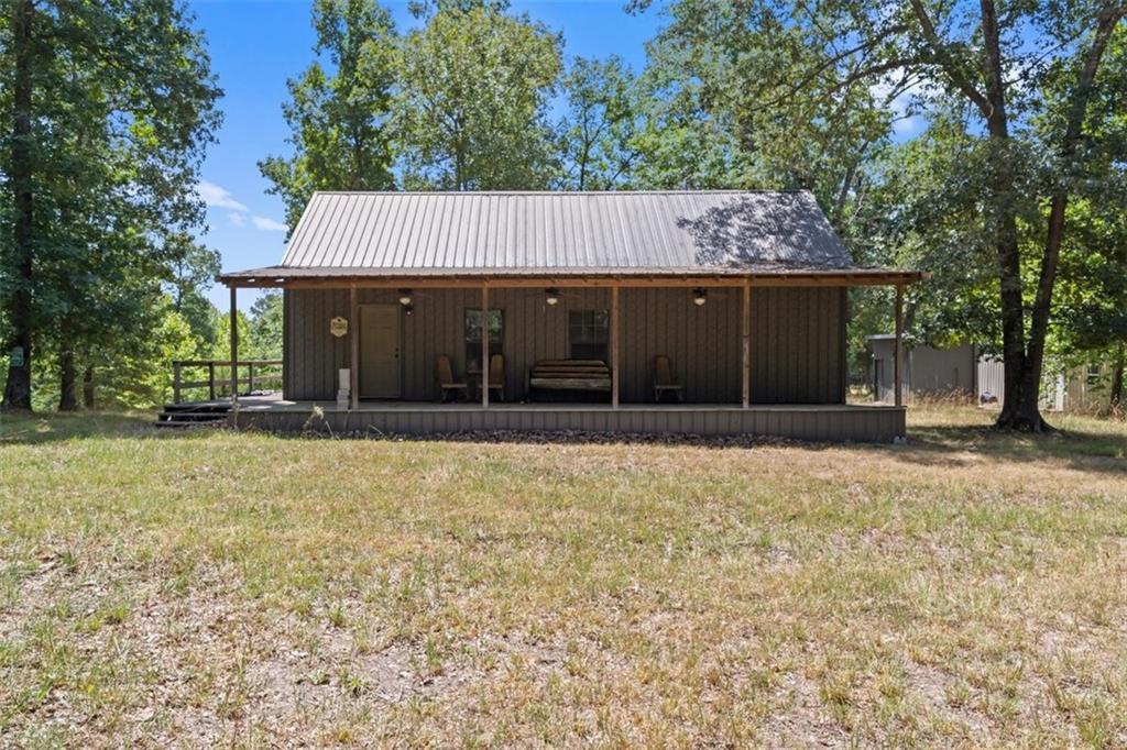 This property is located in the heart of the Northwest, AR and consists of 232 acres and a 980 sq/ft cabin. A recreational retreat of this caliber is extremely hard to find in today's market. If you have been looking for a property easily accessed then look no further. The cabin has a large living room and kitchen area, 2 bedrooms, 1 full bath and a mudroom. The property is turnkey for the avid outdoorsman. There are food plots and stands in place. Also included is a large feed bin, refrigerator room and Conex box located behind the cabin. The property has large mature hardwoods and pine. Privacy won't be an issue since this property sits at the end of the road.