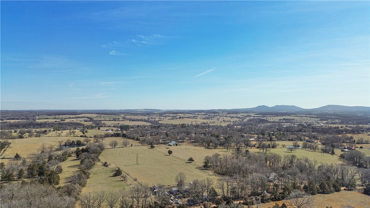 Just outside the Harrison city limits, this 25-acre property offers great views, multiple building sites, and excellent pasture. The land is fully fenced and cross-fenced, featuring two ponds and a corralāperfect for livestock or recreational use. A 70x70 barn is already in place with city water and electricity on site. With no restrictions, the possibilities are wide open. Conveniently located just 1.4 miles from Forest Heights School and only 2 miles from downtown Harrison, this is a rare find that combines space, accessibility, and potential.