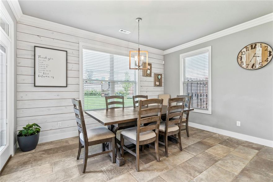 PRICE REDUCED + $10,000 BUYER INCENTIVES! Welcome to this luxe 4 bedroom, 2.5 bath home featuring a generous bonus room and private office in desirable West Springdale, just moments from 3 top-rated schools! Enjoy the light-filled open layout showcasing a designer kitchen with crisp white cabinetry, a sleek gray island, and polished 3 cm granite counters. Custom details add inviting charm to the office, living room fireplace, and kitchen. Enhanced bathrooms include extensive tilework and double vanities for added convenience. French doors open to the primary suite’s spa-like bath with jetted tub and an upgraded custom tiled shower creating a relaxing retreat. Step outside to an expansive covered patio ideal for unwinding, grilling, or hosting friends. New roof and guttering in 2025 provide peace of mind. Nestled in the picturesque Tuscany community known for its welcoming and vibrant atmosphere, pool with clubhouse, and neighborhood pride. Minutes to shopping, dining, & quick I-49 access.