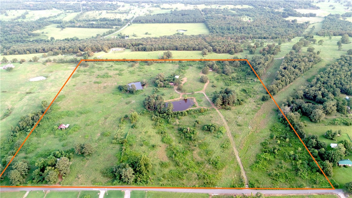 Multi-Home Property on 40 +/- Acres with Ponds, Pasture & More!
Just south of Ozark, AR, this 40 +/- acre property is full of potential for investors, hobby farmers, or anyone looking to make Arkansas home. It includes 3 homes, with two likely livable with some work. The land has supported up to 50 cattle in the past, and the pasture could be reclaimed for grazing.
The main house is 1,430 +/- sq ft with a 24'x24' detached garage and lean-to, sitting on 1 +/- acre with a view of the larger pond. The second home is 840 +/- sq ft on 1 +/- acre, great as a rental or first-time home. The cabin rests in the SW corner with northern views and plenty of potential.
The property offers two ponds, one previously stocked with catfish, panfish, and bass.
Arkansas Valley Electric, Riversouth Rural Water, natural gas, & Wave Rural Connect fiber internet are available. With 1,400 +/- ft of paved road frontage and the investment opportunity - this place has a TON of potential for those willing to capitalize on it.