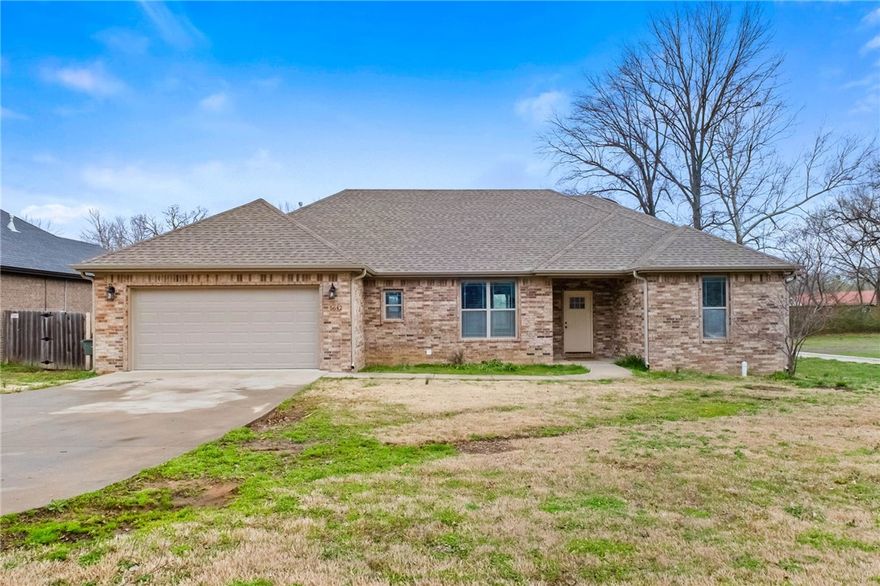 Welcome to this inviting 4-bedroom, 2-bath home in desirable east Fayetteville. Built in 2017 and offering 2,046 sq ft, this single-level home sits on a generous 0.39-acre lot and features an open layout designed for comfortable everyday living and easy entertaining. The spacious living area flows seamlessly into the kitchen and dining space, creating a warm gathering place for family and friends. A split-bedroom floor plan provides added privacy for the primary suite, while the additional bedrooms offer flexibility for guests, office space, or hobbies. Enjoy evenings by the gas-log fireplace or relax outside on the covered patio overlooking the fenced backyard. Conveniently located just minutes from shopping, dining, and the University of Arkansas, this home blends space, comfort, and location in one great package.