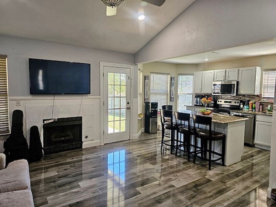 Welcome to your new home in desirable Springdale. This 3 bedroom 2 bath home offers a bright, open-concept living area that's perfect for both relaxing and entertainment.  Gas chimney, recessed lights, luxury vinyl floors and wood paneling design in living room. Kitchen was recently remodeled in 2023 with granite countertops and stainless steel appliances. Which will convey with the sale of property. Covered back patio was added in 2023 with recessed lighting and fans. Perfect for outdoor living and entertainment. Split floor plan, freshly painted main bathroom, walk in closets in main bedroom, storm door and much more. Don't miss out on this charming home!