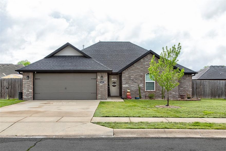 Welcome home to 1621 Whirlaway Lane in charming Prairie Grove! This lovely 3-bedroom, 2-bathroom ranch style home offers a perfect blend of comfort and style and is conveniently located near a park and schools. Easy-care and durability with the wood-look tile flooring throughout the main living areas, a beautifully updated tile shower in the primary suite, and sleek stainless steel appliances in the kitchen. Cozy up by the gas fireplace on cooler evenings, or step outside to the fantastic covered patio and uncovered wood deck. Plus, enjoy the convenience of a 2-car attached garage and wood privacy fence!