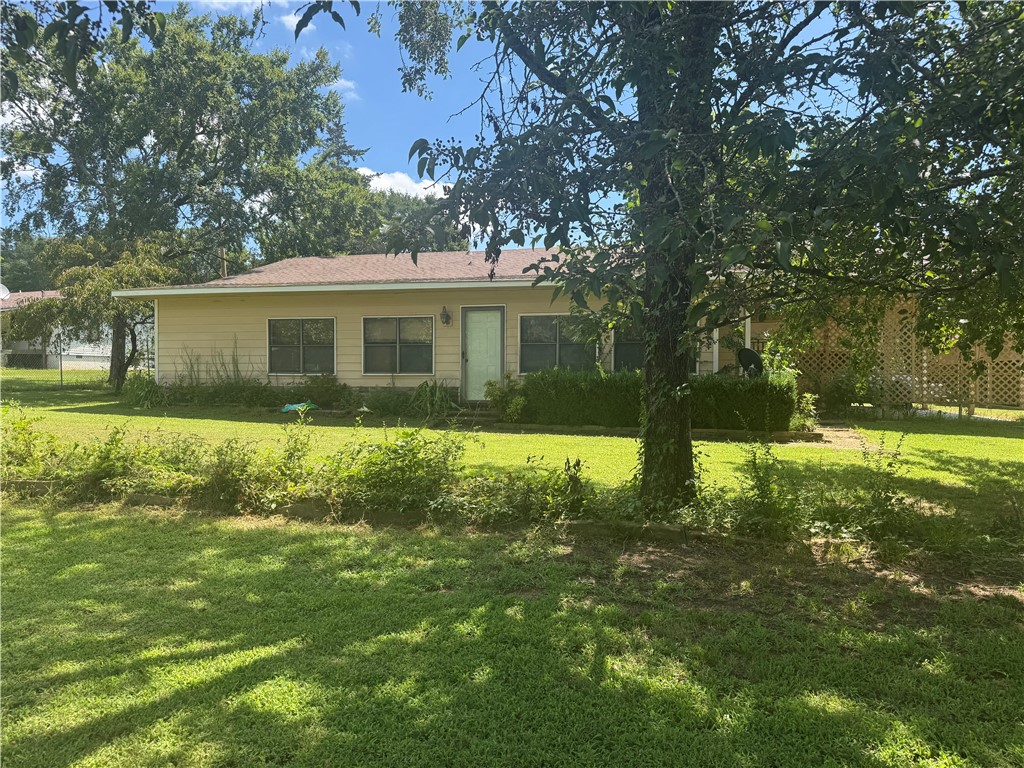 Just steps from Shoal Bay Park on Lake Dardanelle - with easy access to the boat ramp, fishing, camping, and outdoor recreation. This spacious 1,828 sq ft. home features an oversized bedroom with an attached bath, a total of 2 full bathrooms, a huge sunroom ideal for a game room, and additional living space. The kitchen has ample cabinet and counter space for party planning. Graveled RV/Boat pad located at the south end of the main house. All situated on a private and spacious 1-acre lot. With a 30X40 metal shop in the backyard. Whether you're looking for a full-time home, a weekend like retreat, or an investment opportunity with rental potential, this one-of-a-kind property has it all!