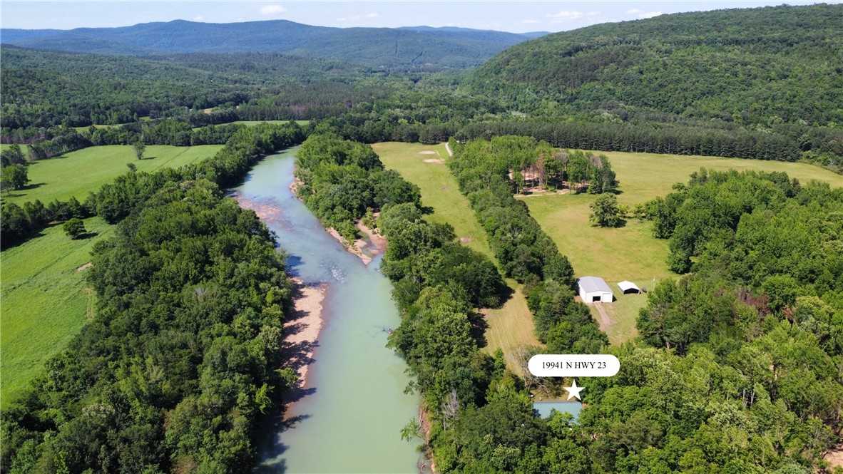 Nestled on the banks of the Mulberry River just down from Turner Bend, this cabin offers stunning natural beauty and exceptional privacy. Spend mornings on the deck, coffee in hand, listening to the river flow. The property is a perfect put-in or take-out point for floating and lies in the heart of the Mulberryās best stretch. Teeming with wildlifeādeer, turkey, and small gameāideal spot for outdoor lovers.
Located just 13 miles north of I-40 via scenic Highway 23. A rare chance to own a riverfront cabin.
*Property will need to be surveyed. See attached photos for proposed 5-acre lot lines.*
- Approx. 125 yards of private Mulberry River frontage
- Excellent swimming and fishing hole off the back porch
- Ozark National Forest bordering across the riverāover 1/4 mile in both directions.
- Approx. 4 wooded acres behind the home
- Established vineyard and garden in front yard
- 2,558 sq ft cabin with beautiful wood interiors and cozy cabin vibes