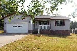 Great location in town with open/split floor plan, fenced back yard, deck, office, large laundry & 2 car garage. Seller is The Secretary of Agriculture. Seller to convey title via a quit claim/non-warranty deed only. All #'s are approx., age is estimate, square footage per assessor.