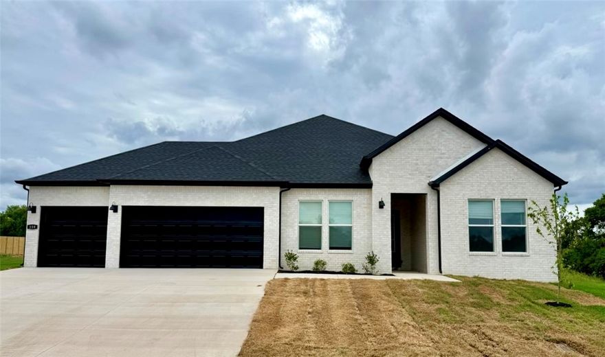 The Garland plan in Renley Rae in Springdale, AR! This plan offers 4 bedrooms and 3 bathrooms! Single-story homes feature engineered wood flooring throughout and tile flooring in the primary bathroom. The kitchen features quartz countertops, 42’’ cabinets, black hardware, and a gas range. The living room features a beautiful modern fireplace with a poplar mantle! Fans are included in all bedrooms and the living room! The primary ensuite will have a walk-in shower, separate tub, and quartz countertops! The exterior of these homes will have 4-sides brick with Hardie® siding (per plan) with a 3-car garage! Each home will have a lovely covered back patio. Taxes, HOA, and parcel TBD. Home is located within Tontitown city limits, but has a Springdale address and zip code.