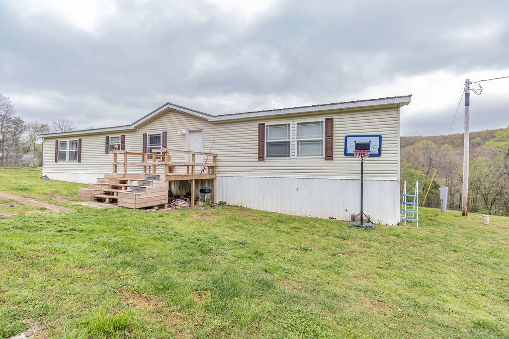 Darling home in the beautiful Arkansas country! Cozy living space with charming eat-in kitchen has center island and stainless steel appliances. Nestled on almost 9 acres with breathtaking views and wildlife galore! This home is located has beautiful creek frontage on Cove Creek. Make this country gem yours today! Previous contract fell thru due to buyer financing but is FHA approved