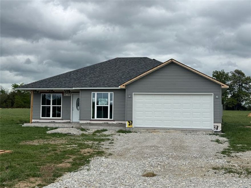 New construction offering 1,202 square feet of well-designed living space on a very nice 1.66-acre lot in the Batavia Community. This 3-bedroom, 2-bath home combines modern finishes with a peaceful rural setting, all while being just minutes from Harrison and convenient access to U.S. Highway 412. The home features-stained concrete floors, granite countertops, LED lighting throughout and brand-new kitchen appliances. The open living area is highlighted by a stylish box-style ceiling, creating a spacious and inviting atmosphere. The master suite includes a walk-in closet and a private bath with a double-sink vanity. A 450-square-foot garage provides ample storage and parking. With quality craftsmanship, modern design, and a great location, this property is ideal for those seeking new construction with room to enjoy country living while staying close to town. Seller will assist in buyer's closing cost.