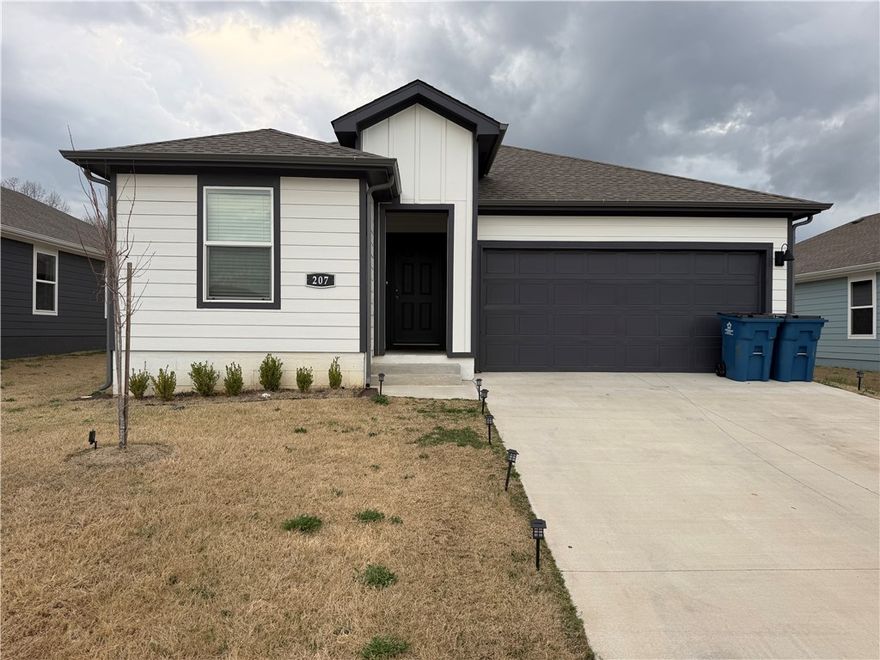 Welcome to 207 NW Pinwheel St in the growing Applewood Estates community in Highfill, AR! This home features an open-concept floor plan designed for modern living and entertaining, with seamless flow between the spacious living area and beautiful kitchen. Enjoy 36-inch upper cabinets, granite countertops, stainless-steel appliances, LVP flooring in main areas, cozy carpeted bedrooms, LED lighting throughout, garage door opener, and professional landscaping. Take in rolling hill views while being just minutes from Northwest Arkansas Regional Airport and convenient to shopping, dining, and major employers in Rogers and Lowell. Highfill continues to see exciting growth and demand. Owner financing available with a down payment—ask for details! Schedule your private showing today!