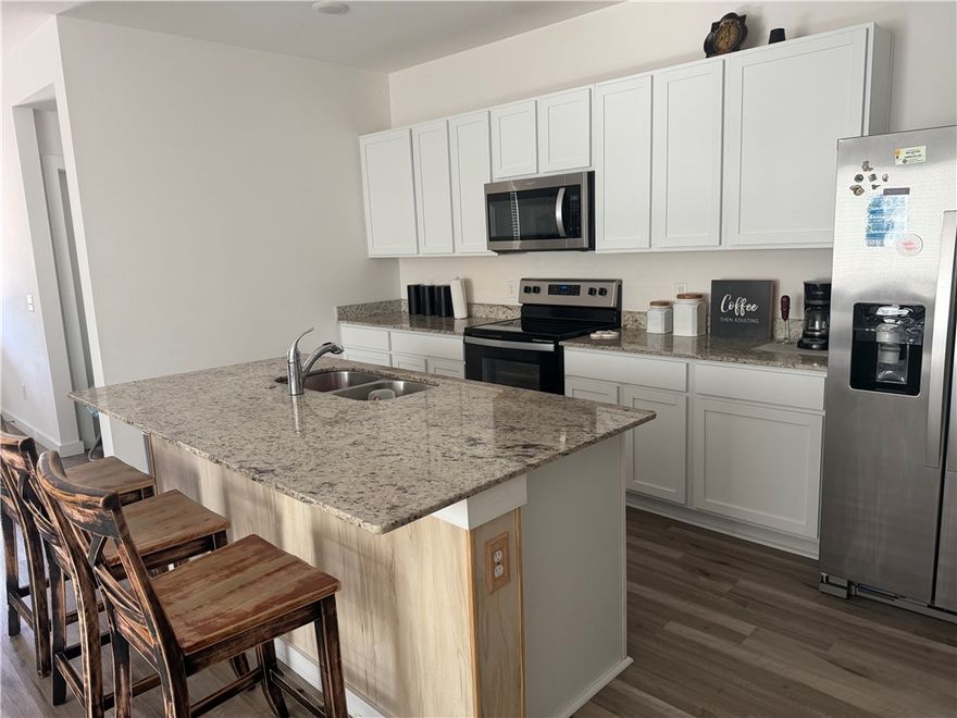 Welcome to 207 NW Pinwheel St in the growing Applewood Estates community in Highfill, AR! This home features an open-concept floor plan designed for modern living and entertaining, with seamless flow between the spacious living area and beautiful kitchen. Enjoy 36-inch upper cabinets, granite countertops, stainless-steel appliances, LVP flooring in main areas, cozy carpeted bedrooms, LED lighting throughout, garage door opener, and professional landscaping. Take in rolling hill views while being just minutes from Northwest Arkansas Regional Airport and convenient to shopping, dining, and major employers in Rogers and Lowell. Highfill continues to see exciting growth and demand. Owner financing available with a down payment—ask for details! Schedule your private showing today!