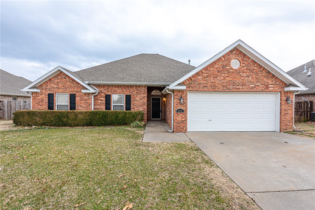 Check out this 3 bedroom 2 bathroom home located near schools and easy access to Don Tyson Parkway! This home features a landscaped lawn and fully brick exterior! Inside you’ll find an open-concept living space perfect for entertaining guests & family, or relaxing by the fireplace. You’ll be the perfect host or guest when you cook in your U-shaped kitchen with abundant cabinetry with bar top counter space. Hide away in your private master suite with tray ceiling & wood floors or rejuvenate in your master spa with walk-in shower, his & her sinks, jacuzzi tub, and walk-in closets. Plus two more bedrooms with wood flooring & another full bath with double vanity. Step out back and enjoy the seasons from your covered back patio or in your fully fenced backyard. Act quick! This home is one you don't want to miss!
