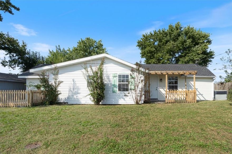 Cozy cottage on a quiet street minutes from downtown Rogers. This 2 bedroom, 2 bath home features updated bathrooms, great natural light, a large backyard, and a storage building ---- come see to believe. Great starter home or investor property for rental.