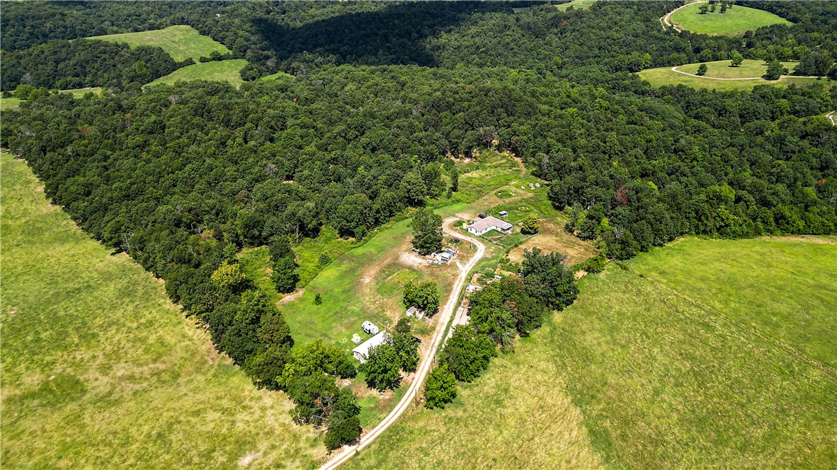 Just over 20 Acres with a Nice home! This Fabulous Madison County property is mostly wooded. The property is set up nicely as a small farm with pens and stalls, as well as coops for chickens and other fowls. There are also a few outbuildings on site. Wildlife, including deer and turkey are ever present on the property. Surrounded by rolling hills, this Ozark delight is waiting for a new owner. The property is available as a package, or as individual 20 acre parcels each with a home. The property offers Ozark country living, that is just far enough outside of town to provide privacy, but close enough to the amenities of the city. This property is best viewed in person to appreciate its greatness and potential. Whether it's a home in the country, two homes in the country, a family compound or a farm, this property provides it all. Take your pick or Snag them both!
See MLS#1318333 and MLS# 1318370