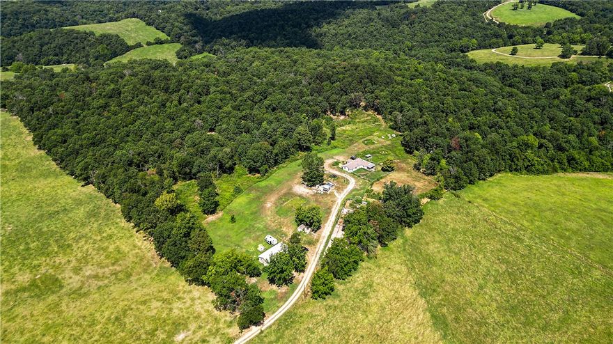 Just over 20 Acres with a Nice home! This Fabulous Madison County property is mostly wooded. The property is set up nicely as a small farm with pens and stalls, as well as coops for chickens and other fowls.  There are also a few outbuildings on site. Wildlife, including deer and turkey are ever present on the property.  Surrounded by rolling hills, this Ozark delight is waiting for a new owner.  The property is available as a package, or as individual 20 acre parcels each with a home.  The property offers Ozark country living, that is just far enough outside of town to provide privacy, but close enough to the amenities of the city.  This property is best viewed in person to appreciate its greatness and potential. Whether it's a home in the country, two homes in the country, a family compound or a farm, this property provides it all.  Take your pick or Snag them both! 
See MLS#1318333 and MLS# 1318370