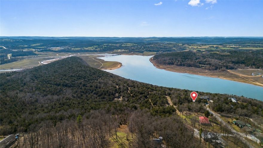 Build you dream home on this .40+/- acre lakefront lot located on Bull Shoals Lake. This wooded parcel is in a platted subdivision and fronts Corps of Engineers property. Sitting on a paved road with both electric and public water available, this property is only 25 minutes to Harrison and less than an hour from Branson, MO.