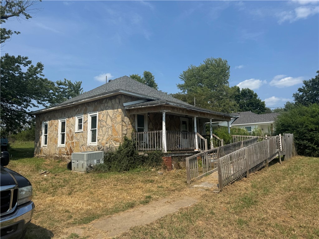 Opportunity knocks in the heart of Lincoln! This charming stone-sided home sits just half a mile from Harps Grocery and offers easy access to everything town has to offer. With a covered front porch and a wooden ramp for accessibility, the property welcomes you with potential. The spacious backyard backs up to an open field, providing privacy and a peaceful view. Whether you're looking to renovate for yourself or invest in a project, this fixer-upper is full of possibilities. Sold as-is ā bring your vision and make it your own
