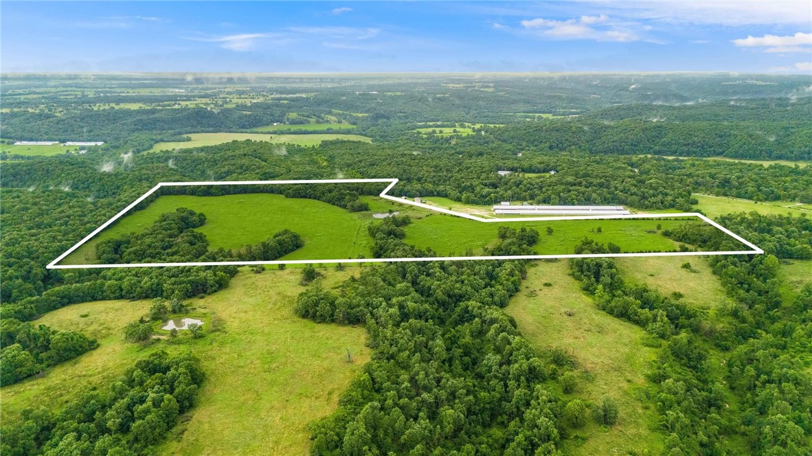 Almost 56 acres of productive pastureland in Decatur, Arkansas, with a mix of open fields and wooded ravines. Previously used for cattle and currently in hay production, the land has been soil-tested and is established in Bermuda grass, ryegrass, and tall fescue. Thereās one pond on the property, and water is available at the road. The wooded areas and natural cover provide great habitat for deer and turkey, making it a solid hunting property as well. Whether you're looking to run livestock, harvest hay, or build a homestead, this land offers space, privacy, and versatility in a peaceful rural setting.