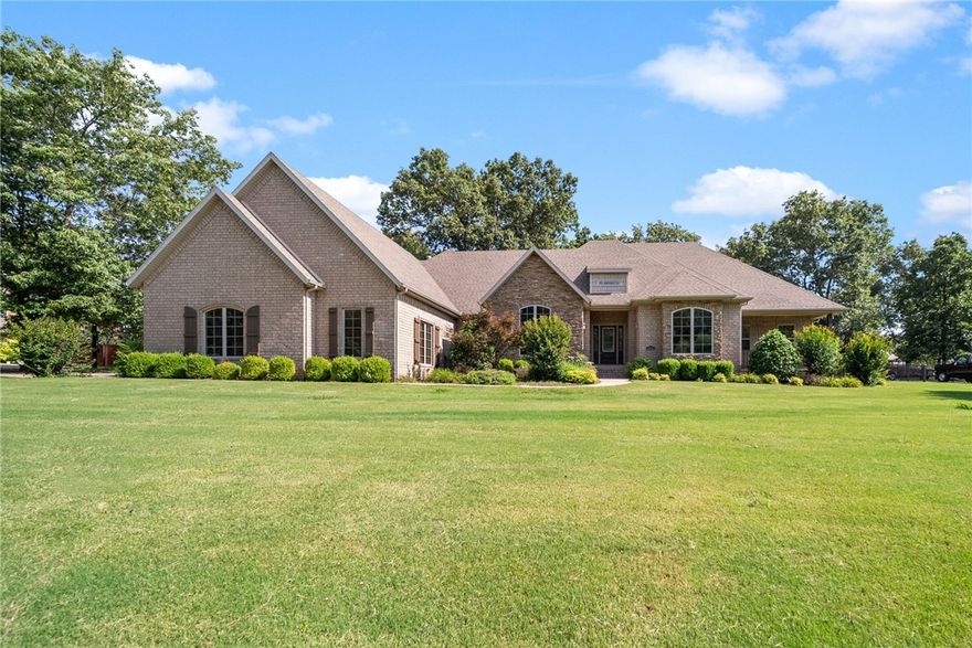 This stunning Fayetteville home offers an incredible blend of luxury & practicality. From the moment you step inside, you are greeted by solid wood doors throughout, giving the home a warm & inviting feel. The eat-in kitchen is a chef's dream, complete with a gas cooktop, ample storage & a pantry. The formal dining room & butler's pantry are perfect for hosting dinner parties, while the stone fireplace & built-ins in the living room create a cozy atmosphere. The dedicated office space & bonus room upstairs provide plenty of room for work & play. The home is equipped with central vacuum & a security system. The master suite features a trey ceiling, lighting, & a huge walk-in closet. The spa-like bath boasts a double vanity, a tiled shower, & a jetted tub. Outside, the home features a covered porch on the front & a screened-in patio on the back, providing the perfect spaces to enjoy the beautiful .71 acre lot. Overall, this home is a rare find, offering the perfect combination of luxury, comfort, and convenience.