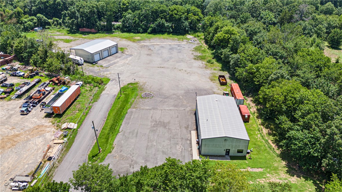 1031 Tax Exchange Opportunity! Currently leased with 2 separate tenants, Monthly Rent $4,700. This property includes 4.61 Acres and the sewer is running along the entire inside of this property for future expansions. The first building to the right as you enter is a Metal Shop 40 X 72 With roughly 800 Sqft that is office space. This building includes 4 Offices and 2 baths all heated and cooled by one Central Heat and Air unit. The second building to the left is a Metal Shop Newly built 60 X 40 with an Office, storage room and bathroom. This building includes 4 Roll up doors and a 12 Ton Car lift. Both buildings are setup with video cameras and full security around the property. This property is currently on one water meter and the water bill for both is paid by the seller.