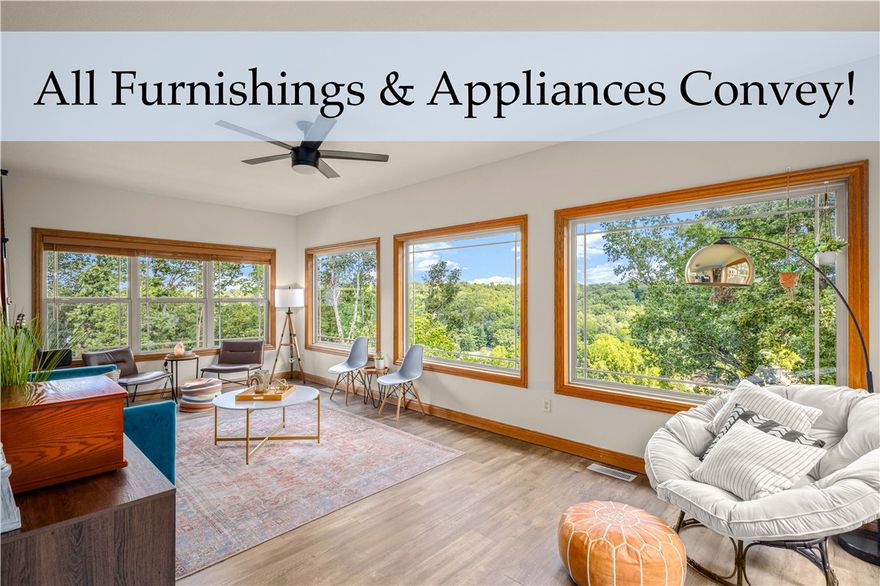 Dreamy Lakeview Retreat on Lake Ann – Turnkey Investment! Discover a rare opportunity to own a fully furnished, income-producing short-term rental on Lake Ann in Bella Vista, this one-of-a-kind home is a proven Airbnb favorite, offering instant cash-flow potential. This spacious retreat features 5 large bedrooms + office/flex space, 3 full bathrooms, 2 living areas, 2 full kitchens and 2 laundry rooms, making it ideal for larger groups or multi-generational living. With its split-floor plan on each level, privacy and comfort come naturally. The primary suite is a true sanctuary with lake views, oversized spa bathroom, and 3 spacious closets. Sunlit living and sunrooms showcase year-round panoramic lake views. Step outside to a handicap-accessible wraparound deck, private hot tub, and outdoor oasis. Close access to Back 40 and Summit School trails, with the Lake Ann boat ramp just 5 minutes away. New roof (2021), septic pumped & inspected (2023). Offered fully furnished for seamless Airbnb operations.