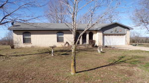 Peaceful country setting. Nice 3 bedroom 2 bath brick home on 2 acres approx. 10 miles from Harrison. Living & family rooms, join to make a great room with a gas log fireplace. All fenced. Detached 2 car carport/shop. Garden area. Room for a couple horses.