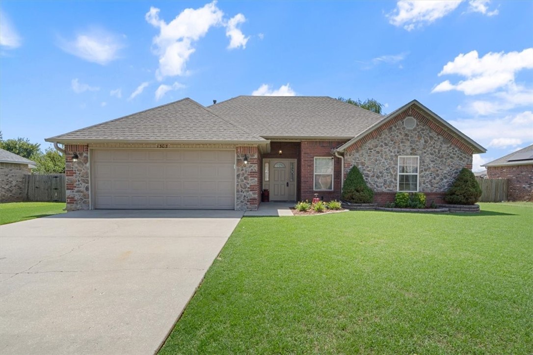 Don't miss this conveniently located home in the heart of Pea Ridge! Close to schools, shopping, dining and the new disc golf course. Walk in the front door to an inviting living room with a wood burning fireplace that flows seamlessly into the dining and kitchen area. Step outside from the kitchen onto a partially covered oversized deck, and enjoy the large, flat backyard with a firepit and swings. Back into the house, the master has separate vanities and his and her closets. This home will make a great starter home or for someone looking to downsize. The full brick exterior makes maintenance a breeze. Let's talk about the new! New roof 2024, new HVAC 2024, water heater replaced in 2021. Refrigerator, 2 year old washer and dryer and 6.1 Klipsh surround sound with subwoofer convey. Living room furniture negotiable.