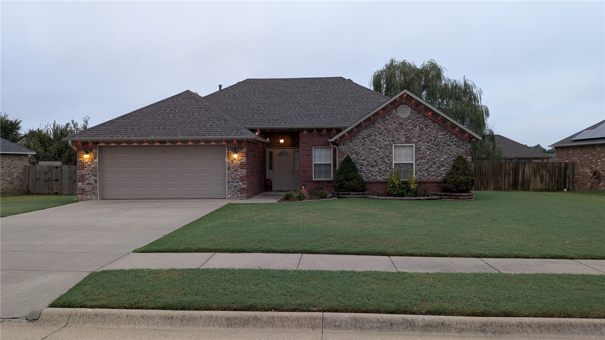 Don't miss this conveniently located home in the heart of Pea Ridge! Close to schools, shopping, dining and the new disc golf course. Walk in the front door to an inviting living room with a wood burning fireplace that flows seamlessly into the dining and kitchen area. Step outside from the kitchen onto a partially covered oversized deck, and enjoy the large, flat backyard with a firepit and swings. Back into the house, the master has separate vanities and his and her closets. This home will make a great starter home or for someone looking to downsize. The full brick exterior makes maintenance a breeze. Let's talk about the new! New roof 2024, new HVAC 2024, water heater replaced in 2021. Refrigerator, 2 year old washer and dryer and 6.1 Klipsh surround sound with subwoofer convey. Living room furniture negotiable.