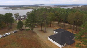Another bueatiful build by Herrera's Custom Homes LLC. This 3 bed 2 bath 2083sft home with a split floor plan sits on a 1.85 acre +/- corner lot cul de sac across from The Arkansas River. Close to public fishing and recreation and minutes to I-40. Custom built cabinets, LG stainless steel kitchen appliances, LED lighting, tile showers, Luxery waterproof vinyl flooring, quartz countertops, modern light fixtures, covred porches front and rear, 2 car garage, you have to see this one in person, This one wont last long call for your private showing today! *finished pictures are for reference only from previous builds colors and design choices of actual finished product may vary. Updated finished pics will be added as the home is completed inquire with listing agent for up to date pics & info.