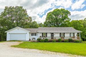 Located only a few minutes for Harrison City limits on the north end of town (just 30 minutes from Branson) is the very nice updated 4 bedroom 2 1/2 bath home with full finished basement on 3.93 acres M/L. Plenty of trees for privacy and still have the beautiful view of the Ozark Mountains. There is a new roof and central air conditioner. The home has a 2 car attached garage plus a 24'X30' shop with concrete floors, electric, and 2 large garage doors. Live the country life with in town conveniences. Seller will provide $5000 flooring allowance with acceptable offer.