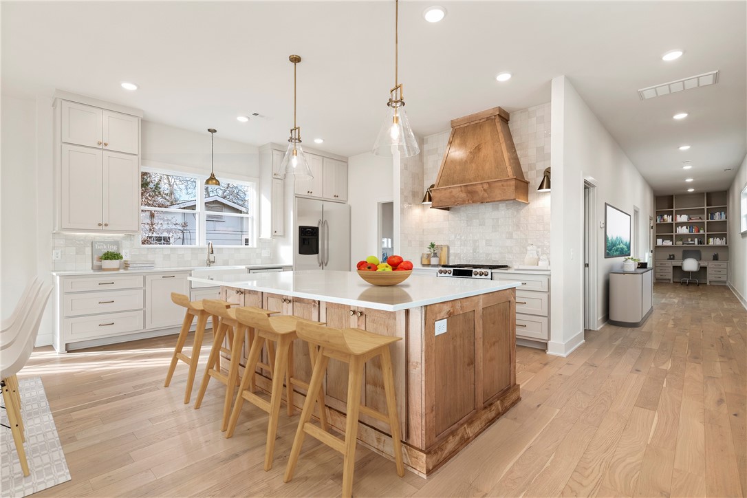 Make your Downtown Bentonville lifestyle dreams a reality in this gorgeous new construction home located just a few minutes by bike or foot to the Bentonville Square, The Momentary, 8th Street Market, Greenway Trail, new WM Campus, restaurants & entertainment! A clean, modern color palette w/champagne gold fixtures creates a calm and restful retreat. Large kitchen w/custom cabinetry, quartz counters, GE Cafe appliances, 8'x5' island w/bar seating, gas cooktop,& huge butler style pantry. Open concept living/dining w/side patio makes this home perfect for entertaining guests. Upstairs large 2nd living space w/fireplace +wet bar w/wine fridge & walk-out access to covered front balcony w/view of The Momentary. Primary suite w/princess balcony & gorgeous spa-like bath w/garden tub & custom tiled walk-in shower. Main level rear/side-entry garage leads to well designed laundry/mud room w/extra storage space, & built-in desk, plus 4th bedroom w/en-suite bath. 2 upstairs bedrooms share full bath.Tax amount is for lot only.