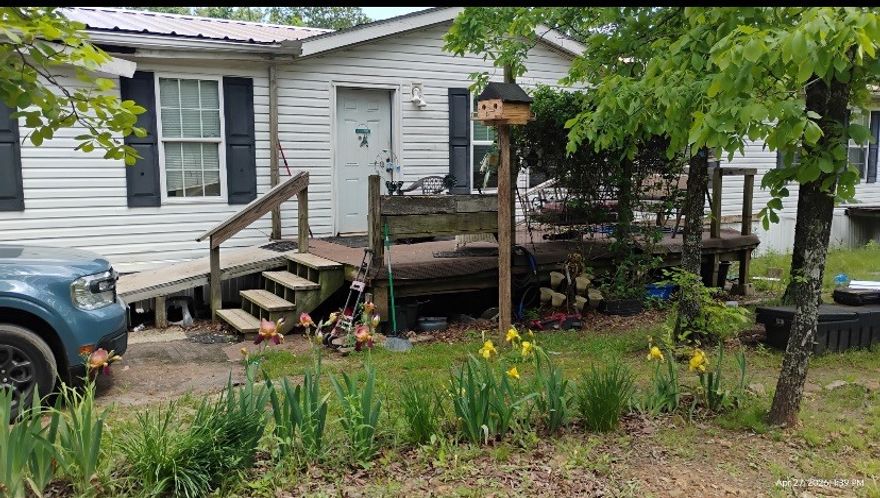 Situated on approximately 4 scenic acres just outside West Fork, this spacious 2,400 sq ft double-wide home features 4 bedrooms and 2 full baths. This property is being offered for sale in conjunction with 14676 and 14678 Cliffbriar Road, enhancing its value and versatility. These additional homes, built in 2025, offer approximately 800 sq ft and 854 sq ft respectively-ideal for rental income, guest accommodations, or multi-generational living. Whether you're seeking a private family compound or a turkey investment, this is the perfect opportunity.