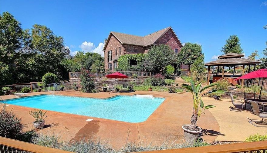 Sold before print. 26 Acres in midtown Gravette, adjacent to Gravette schools grades K-7. Less than 5 miles to the I-49on-ramp. A true Ranch Estate with an impressive 6,900 square foot home with outdoor living and in-ground salt water pool. Magnificently custom crafted with all the right features. Driveway fully paved since photos taken.