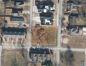 Oversized .44 acre lot right behind new STEM School, within walking distance to the Bentonville Square and just minutes from the current and new Walmart Home Office. Home is currently rented month to month. Surrounded by Moderate to high density zoning. Would be ideal for new moderate to medium density residential development. Also listed ML #: 1322029
