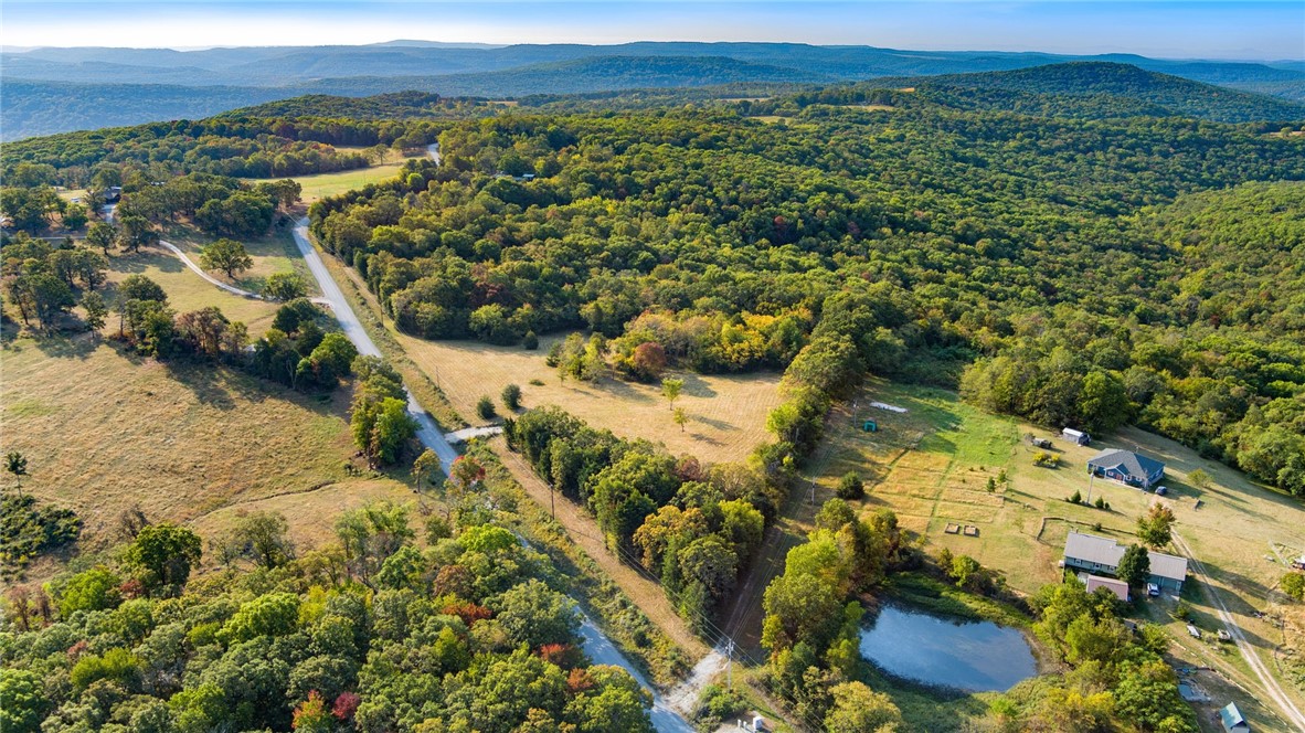 Check out this amazing 12 +/- acres with excellent building spots, amazing views and lots of wildlife. Great location just a few minutes south of Prairie Grove! Easily accessible from Stickler Rd. with a new driveway and battery powered gate.