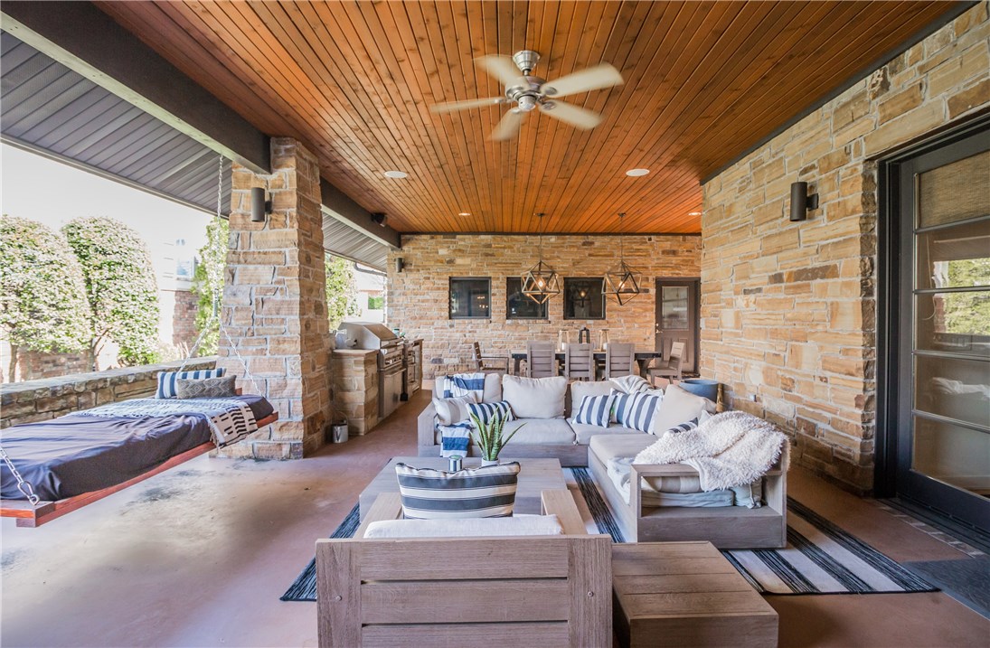This one-of-a-kind home offers a peaceful retreat to relax in comfort and style. The great room features vaulted ceilings & floor-to-ceiling windows that enable an indoor/outdoor experience & makes the home feel bright and airy. Along with a spacious master bedroom suite and home office (which could be a 4th bedroom), the open concept residence also showcases a gourmet eat-in kitchen with large center island, stainless appliances & granite, three-car garage, family and game room, as well as 2 additional bedrooms & 2 full bathrooms in the walk-out basement. The outdoor living is spectacular with multiple entertaining spaces including a relaxing sleeping porch and living space, built-in grill and outdoor fire pit.
