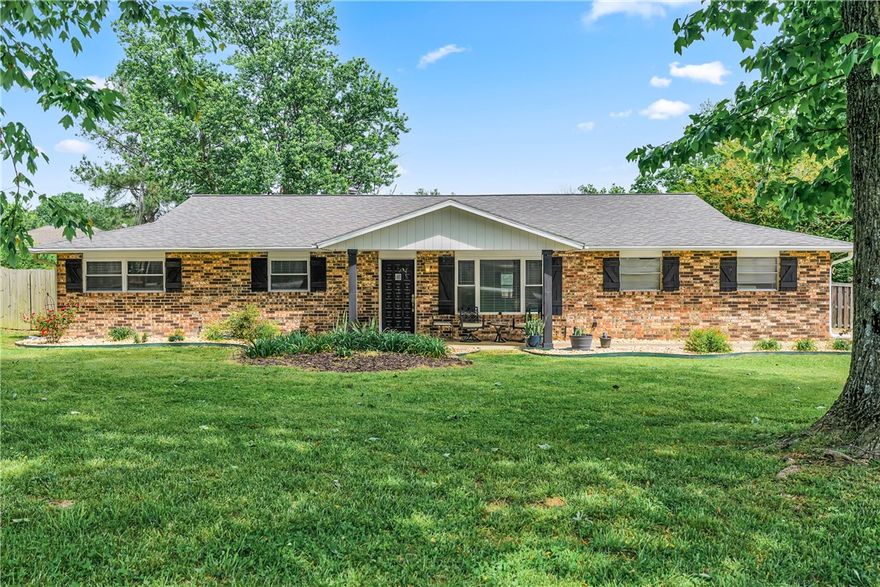 Updated 4bd/2ba on 1.33AC with a 1200 sq ft shop is located less than one mile from the new 612 bypass. Inside, you’ll find thoughtful updates, including an open floorplan with a remodeled kitchen featuring granite countertops & stainless steel appliances. The primary suite offers an XL tiled walk-in shower, dual sinks & a unique sliding mirror that reveals either a backlit touchscreen mirror or natural light from the window. The guest bathroom features copper countertops & sink with a jetted tub/shower combo. The fourth bedroom is off the rear of the home & could serve as a bonus room or formal dining area. The home has been well maintained with major improvements- roof (2020), windows (2022), water filtration system (2023), HVAC (2025), garage door (2025) & new septic leach lines (2025). Outside, the property offers welded pipe fencing & arena, a 3-stall pole barn. Shop has concrete floors, commercial lighting, finished workshop space & loft, providing a rare combination of acreage, updates & location.
