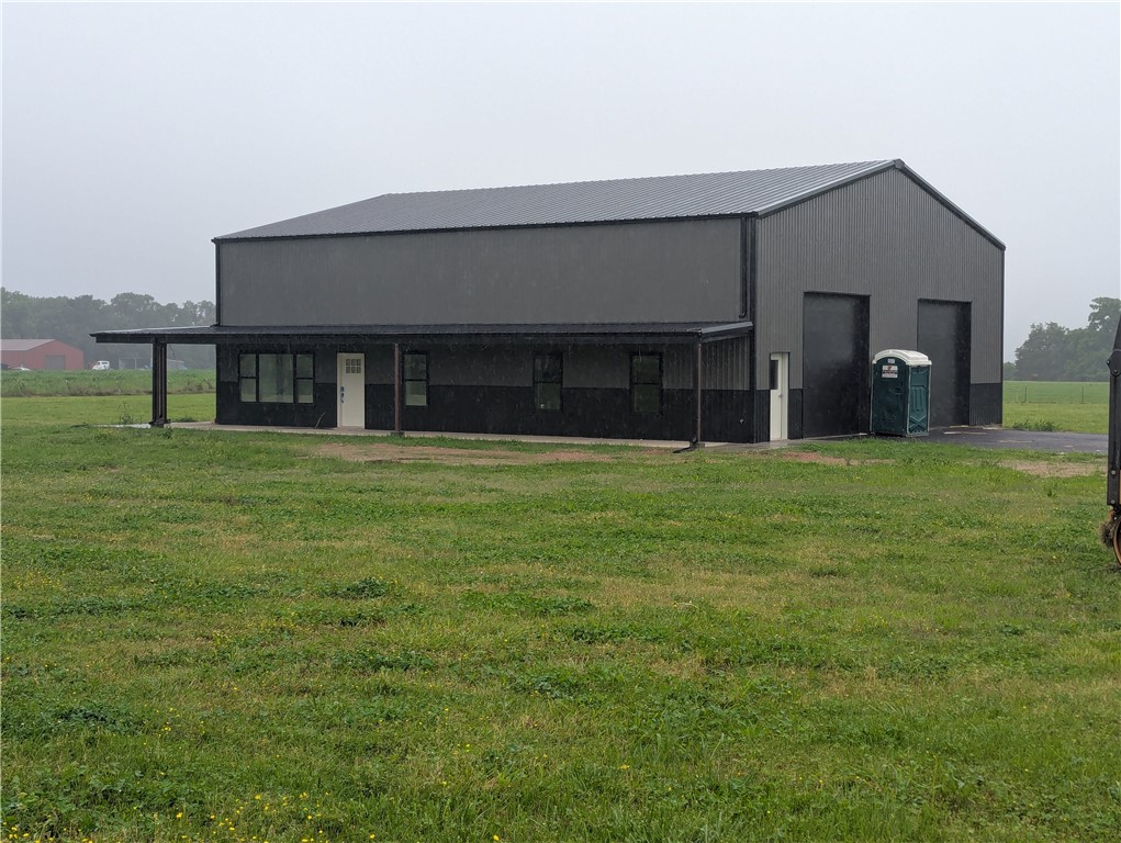 Beautiful new construction on 3 acres in a peaceful setting. Tucked off the main road you will find a 50 x 60 shop house/barndo with 2600 sqft of living space and 1500 sqft shop/garage area. Primary bedroom and bath on the main level. Primary bath has double vanities, a walk-in shower and soaking tub. Upstairs you will find 3 additional large bedrooms that share a full bath with 2 vanities and a shower tub combo. Breathtaking views from the upper level. A large second living area on the second floor as well. Finished concrete on the main floor while the stairs and upstairs will be LVP. The counter tops are a white quartz in the kitchen and baths. Large laundry/mudroom when you walk in from the garage. The full bathroom in the shop area has a walk-in shower and will feature a black countertop with a stainless-steel sink for easy clean up. Stainless steel microwave/oven combo, dishwasher and refrigerator, glass cooktop stove with ventless hood. Anticipated completion date is 08/01/25.