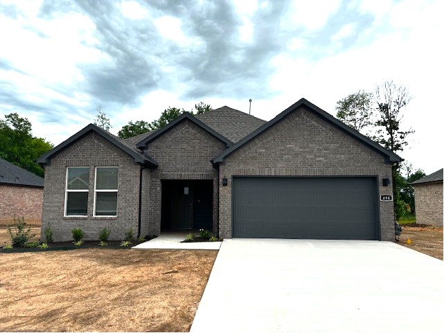 This impressive subdivision, Goose Creek Village, is where quality and affordability meet, in the heart of Farmington. This Denton floorplan spans across 3 bedrooms and 2 bathrooms. Passing through the foyer, you'll find yourself in the grand combination dining room, kitchen, and living room. This home features a beautiful island, gorgeous quartz kitchen countertops, stainless steel appliances, and a walk-in pantry. Private primary bedroom includes ensuite with quartz countertops, double sinks, oversized-shower and walk-in closet. Living room has a cozy electric fireplace with heater. Luxury Vinyl Plank flooring throughout! Fans in all bedrooms as well as the living room! This home exterior will have 4 sides brick. Covered patio and a landscape package included. Garage door opener! Tankless gas hot water heater!