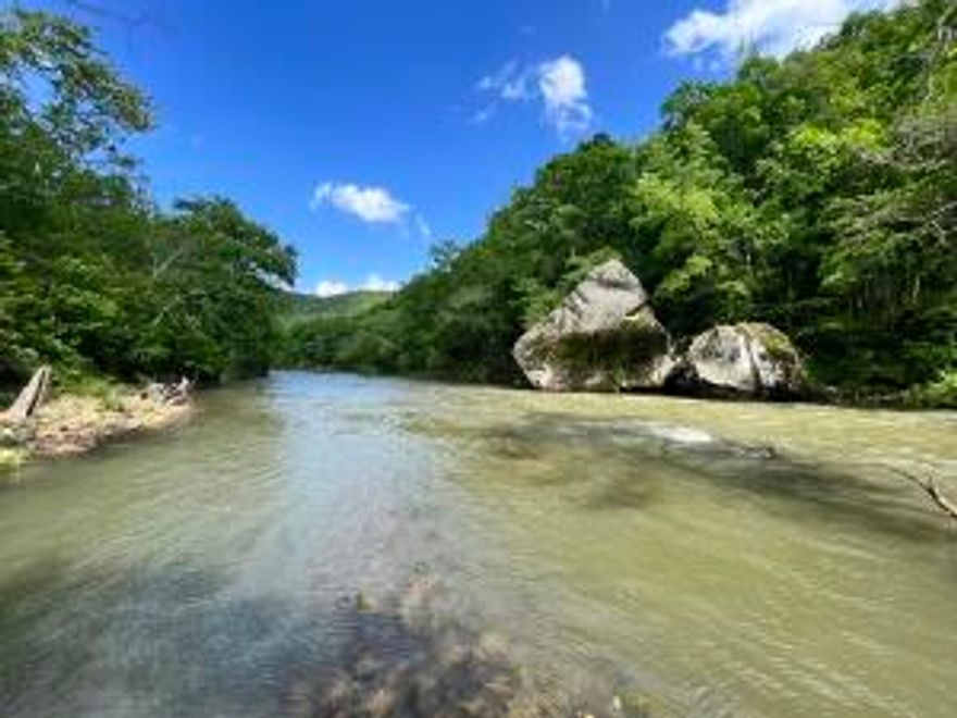 200 acres M/L with 1 mile of River frontage on the middle fork of the Little Red River in the Arlberg Community of Stone County, Arkansas. This property features a 3BD 2 BA 2,329 sq ft main house with an additional 575 sq ft guest cabin. A woodworking shop full of tools as well as a 1500 sq ft Quonset hut for storage also sit on the property. This piece has it all! Water falls, creeks, ponds, River frontage, pasture, mature timber, incredible rock formations, and abundant wildlife. This area has great Deer, turkey, and bear hunting as well as incredible smallmouth bass fishing. This property also lays very well to be split into smaller tracts with easy access off Meadow Creek RD. This piece would be great for the owner occupant or for a recreational tract.Drone/interior photos coming soon