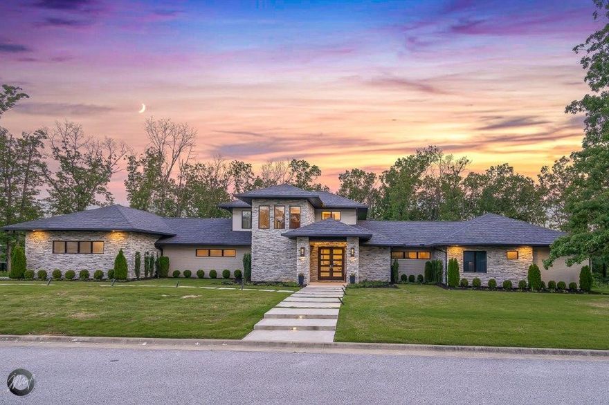 Stunning Versailles Home. Exceptionally built with meticulous attention to detail throughout. Featuring high-end amenities from the foundation up. Contemporary styling with 4,422 sf – 5 bed each with full bath, 2 half bath, multiple living areas, 2.38 acres & oversized 3 car garage. Entry opens to formal living room, dining room & bar alcove, a grand entertaining space. Quadruple sliding doors open out to the gorgeous wooded yard. 10 ft wood ceilings & reflective lighting. Master suite has tea patio, attached bath w/heated floors, large shower & WIC. On the east side of the home is the spacious second living area open to kitchen, breakfast nook & more. Kitchens incredible features include waterfall edge quartz counters, grain matching maple cabinets, Thermador appliances including gas range & steam oven & much more. Breakfast nook has access to the grand patio with seamless railing, pine ceilings & Lion built-in grill station.