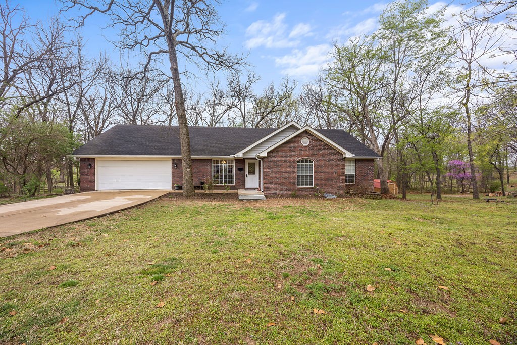 Nestled in Siloam Springs, this rare find offers a sprawling ranch home set on one beautifully wooded acre, with an additional lot included in the price, giving you endless possibilities. Conveniently located near the Aquatic Center, Siloam Springs Intermediate School, and The City Lake Park, this property offers both comfort and convenience.
The home features a recently upgraded kitchen with stunning quartz countertops, sink, faucet, fresh cabinet paint and elegant luxury vinyl plank flooring. Cathedral ceilings add a sense of space while a unique system of decks, including one with a hot tub, provide a serene setting overlooking quiet horse pastures.
The thoughtfully designed floorplan also includes a sunroom, bathed in natural light, creating a perfect spot for relaxing. Even the garage has been designed with practicality in mind, offering a convenient half bath with a utility sink and toilet.
No restrictions on the adjacent lot, offering you the opportunity to build the workshop of your dreams!