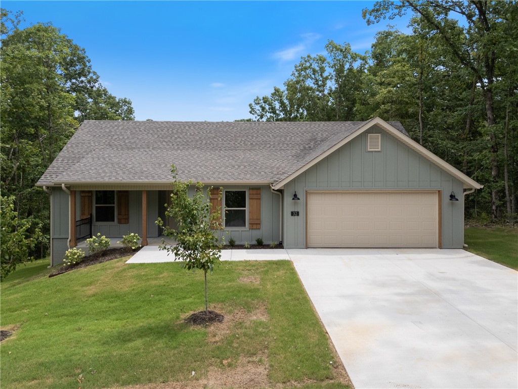 Brand-new 3-bedroom, 2-bath home in a prime Bella Vista location, set to be completed by mid-July! This thoughtfully designed single-story home offers durable LVP flooring in the main living areas, a 2-car garage, and keyless entry for added convenience. Enjoy the outdoors with Lake Windsor just minutes away and Tunnel Vision Trail only feet from your backyardāperfect for biking, hiking, or creating your own private trail access. And you're less than 20 minutes from the Walmart campus. Gutters will be included!