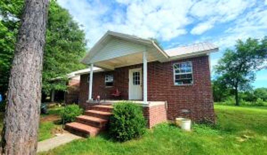 80 acres with small home needing some TLC.