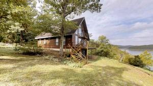 Great home overlooking Bull Shoals Lake. Terrific views from the living room, dining and study. This home has 38 wooded acres with over 1/4 mile Corp frontage. Rare opportunity. Buoy Permit.