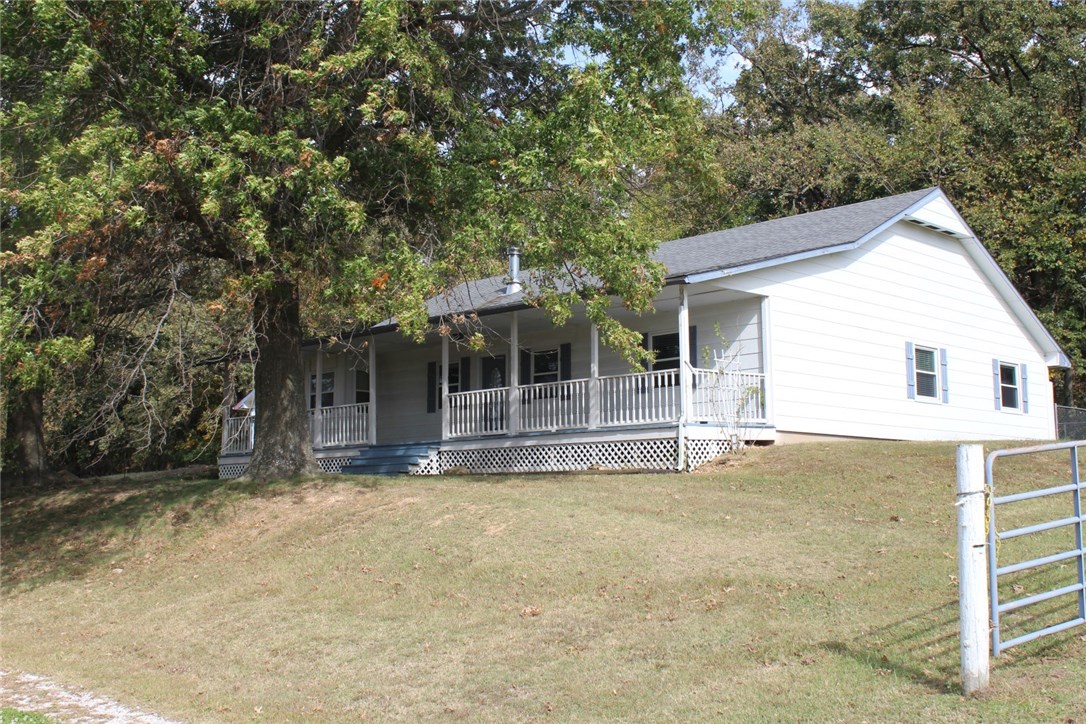 Looking for a nice property at the edge of town? Approximately 2.76ac. with a 2,024 sq. ft. home gives you plenty of space both inside and out. Was previously used as an auto sales business. Currently zoned (RI) Res. Improv. and (RV) Res. Vacant. Property to be sold as is with no disclosures. Arvest employees, directors and their family members are ineligible to purchase Arvest's bank-owned properties. Property to convey via Special Warranty Deed.