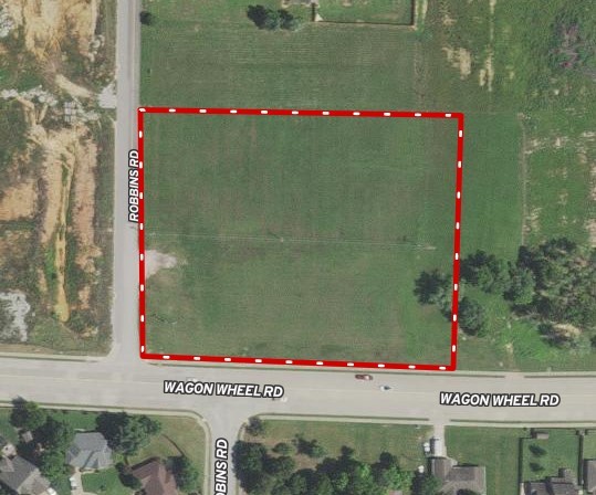 3.66 acres currently zoned C-2 with approximately 450' of Wagon Wheel frontage (see Tract 1 on attached survey). Robins Road is the west boundary for additional access. Close proximity to I-49. Water is on south side of Wagon Wheel. Sewer is available in northeast corner of property. No detention needed on subject property. New survey on file.